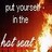 Pixelated text reads 'put yourself in the hot seat' over a gradient background transitioning from dark red to bright orange and yellow.