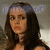 Two side-by-side pixelated frames of a woman with long brown hair, showing slight facial expression differences between the left and right panels.