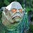 Animated contact sheet showing two frames of a pixelated monster character with orange eyes and greenish skin, alongside blue promotional text for 'Scooby Doo 2' on a gray background.