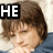 A pixelated image of a person with brown hair in two distinct poses, one with text "HE IS SOOO" and another with "CUTE" flanked by heart symbols.