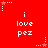 Red background with white text 'i love pez' repeated in a , surrounded by small star and dot patterns
