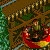 Pixelated scene with two figures in a red vehicle on a brown track, surrounded by green foliage and blue water elements.