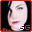 Pixelated face with light skin tone, dark hair, and red lips; two 'GG' letter pairs in white and orange at bottom right corner.