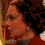 A four- shows a person with dark hair and red clothing in sequential poses, transitioning from profile to front-facing view