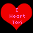 Two identical red heart-shaped icons with pink text reading "I Heart Tori" on a black background, displayed side-by-side.