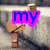 A pixelated image of a wooden figure with a blocky head and limbs, standing on a textured surface, with overlaid text in different colors.