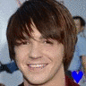 A 96x96 pixel animated buddy icon showing a person with brown hair in two sequential frames, each featuring a heart symbol that changes color between blue and red.