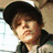 Four distinct pixelated images of a person in various poses and outfits, including a black cap, green cap, and text reading 'JUSTIN BIEBER' with a heart symbol.