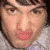 Pixelated image of a person with brown hair and light skin wearing a gray shirt, overlaid by large black text reading 'how does prenendo that?' on white background.