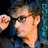Six distinct frames of a person in various poses and settings including adjusting glasses, holding a box, standing near a blue police box, and close-up expressions.