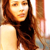 A woman with long brown hair in a sleeveless top appears in a of six with text overlays changing from 'N' to 'NERO' across frames