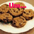 A plate of cookies with red text overlays stating 'Um... the cookies are suppose to go in the oven not the microwave' across four