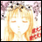 A pixelated anime-style character with long blonde hair and closed eyes, wearing a red outfit against a pink floral background on the left; black background with white text "Anime IM" and stylized "C0M" on the right.