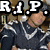 A pixelated image of a person in dark clothing with white accents, overlaid with text elements including "R.I.P." and "HEIDER AKA MONKEYT".