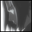 Black-and-white animated icon showing a stylized figure with flowing hair and a hooded cloak against a dark background, with text reading "AnimeIM" and "com".