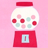 A static image of a gumball machine with red top and base, white glass globe filled with pink and light blue circular candies on a solid pink background.