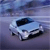 Pixelated image of a light blue car with dark blue accents on a gradient background, viewed from a slightly elevated angle.