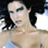 Static 48x48 pixel buddy icon showing a close-up of a person with dark hair and light skin wearing a thin-strapped top, cropped to shoulders and upper chest against a bright background.