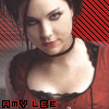 A person in a red top with black lace trim stands against a red and black diagonal striped background, with text reading "AMY LEE" at the bottom.