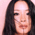 A split-frame contact sheet showing a pixelated portrait of Lucy Liu on the left and green text reading "Original Icons .com" on a dark green background on the right.