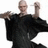 Pixelated image of a person in black clothing with arms extended, accompanied by text reading LOOKS LIKE ME DOESNT HE and a question mark.