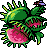 Pixelated green plant-like creature with pink flower, brown accents, and yellow-tipped spikes on a gray background.
