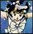 Pixelated static image of a figure with dark hair and light clothing against a blue background, showing partial facial features and arms raised.