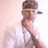 Pixelated image of a person in a white shirt holding a microphone, next to purple text on a black background.