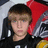 A pixelated image of a person with brown hair and blue eyes, wearing a black shirt, seated in a red and gray chair, with green text reading 'haley is the best and u know it' on a green background.