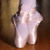 A split-screen image shows ballet shoes on the left and text on the right, with a second version below featuring pink text.
