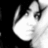 Pixelated grayscale image of a stylized face with a large white oval shape and dark curved lines on a black background.