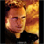 Pixelated static image of a person with light brown hair and warm-toned background, displayed as a 50x50 buddy icon on dark borders.