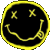 A static circular yellow smiley face icon with X-shaped eyes and a curved mouth, featuring a small guitar-like object on the right side against a black background.