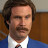 Static 48x48 pixel icon showing a man in formal attire with brown hair, mustache, and beard against wooden paneling background.