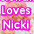 A pixelated image of a person with pink hair wearing a white top, overlaid with bold text reading "Loves Nicki" in purple and white.