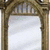 Pixelated image of a stone archway with white light behind it and text reading "It Does no Good to Dwell on Dreams, Harry" in black blocks.
