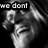 Black-and-white pixelated image of a person with light hair, showing text overlays and a cropped composition.