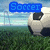 Pixelated soccer ball on grass field with blue text overlays changing across frames, background shows sky and fence.