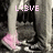 Pixelated image with pink text 'L43VE' overlaid on a grayscale scene featuring vertical structures and a pink shape at the bottom left.
