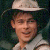 Pixelated image of a person wearing a light-colored wide-brimmed hat and sleeveless shirt against dark background, with green text reading 'Original Icons .com' on right side.