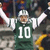 A pixelated football player in a green jersey with number 10 raises arms while standing next to a New York Jets logo on dark green background.