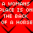 Red background with black chain-link pattern overlaid by repeated white pixelated text reading "A WOMANS PLACE IS ON THE BACK OF A HORSE".