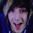 A person with dark hair and light streaks wears a blue hoodie, smiling broadly in three showing slight head movement