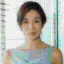 Six views of a person with short dark hair in various poses and expressions against different backgrounds