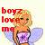 Pixelated static buddy icon featuring a blonde woman with green eyes, purple top, and blue wings holding a pink object against a light background with red text reading "boyz love m".