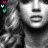 Black-and-white portrait of a person with curly hair, surrounded by small colored heart icons in pink, green, and cyan.