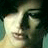 Static 48x48 pixel icon showing a heavily pixelated close-up of a person's face with dark hair and light skin tones, rendered in low-resolution GIF format with visible dithering and color banding.