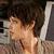 Six distinct character portraits arranged in a , each with unique hairstyles and clothing against varied backgrounds