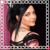 repeated images showing a person with dark hair in a high ponytail, wearing a black and pink striped top against a dark background