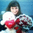 A person holds a white plush toy with red accents against a blue background, displaying subtle pose variations across frames.